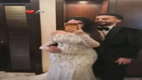 إطلالة أحمد عبد القادر وزوجته في زفافهما بتصميم إسلام سعد تكشف تفاصيل تحضيرات العرس